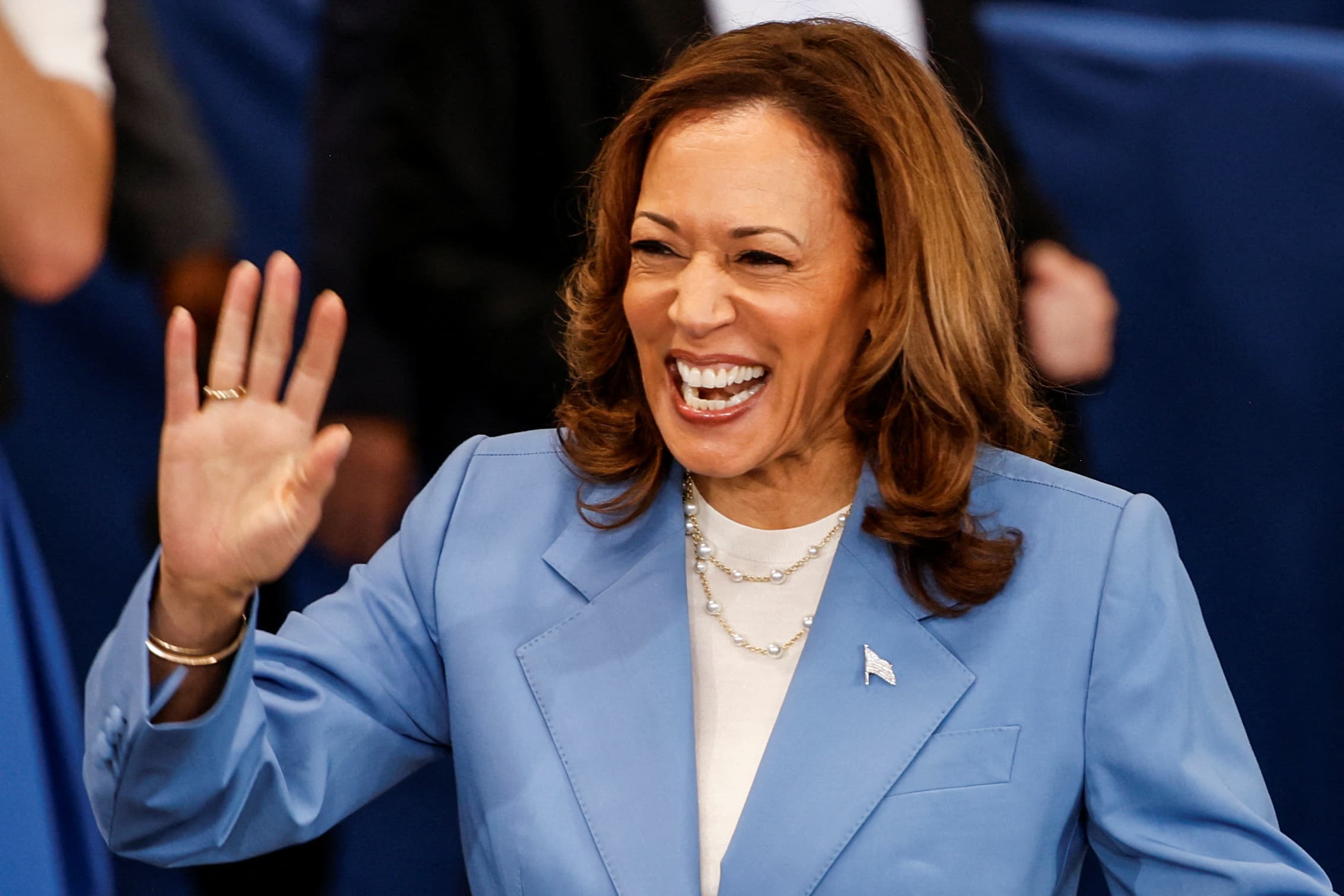 U.S. Vice President and Democratic presidential candidate Kamala Harris waves as she visits the Hendrick Center for Automotive Excellence in Raleigh, North Carolina, U.S., Aug.16, 2024.