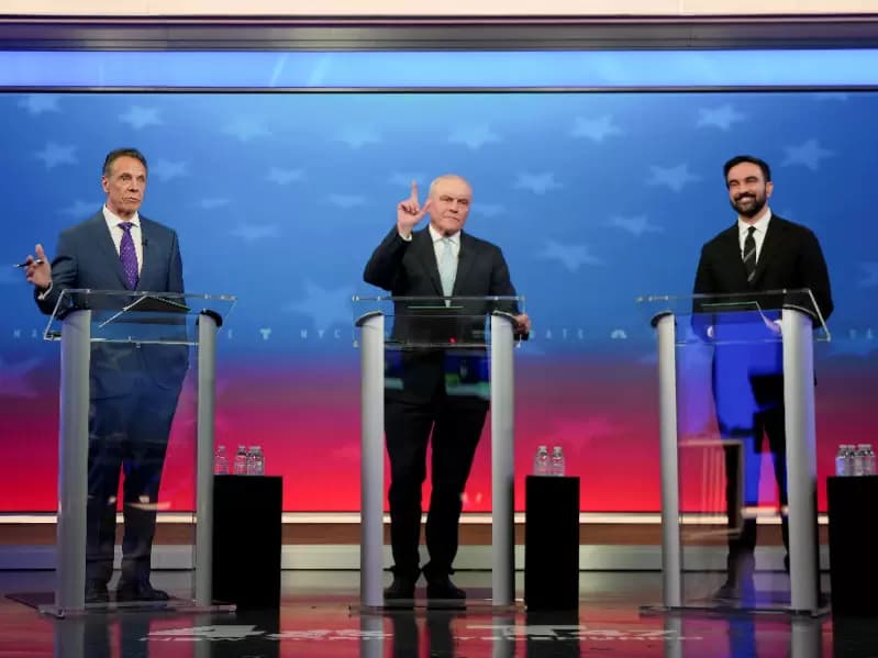 Independent candidate former New York Gov. Andrew Cuomo, Republican candidate Curtis Sliwa and Democratic candidate Zohran Mamdani participate in a mayoral debate, in New York, U.S. October 16, 2025.