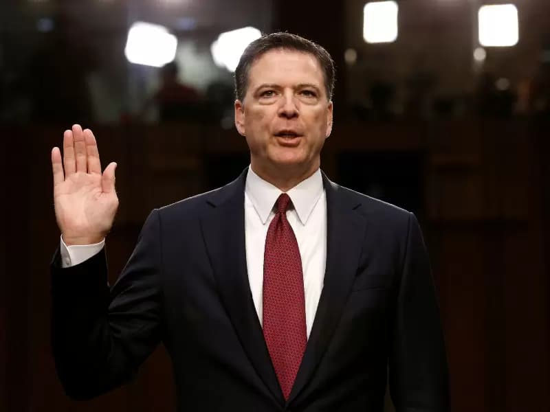 FILE PHOTO: Former FBI Director James Comey is sworn in prior to testifying before a Senate Intelligence Committee hearing on Russia's alleged interference in the 2016 U.S. presidential election on Capitol Hill in Washington, U.S., June 8, 2017.