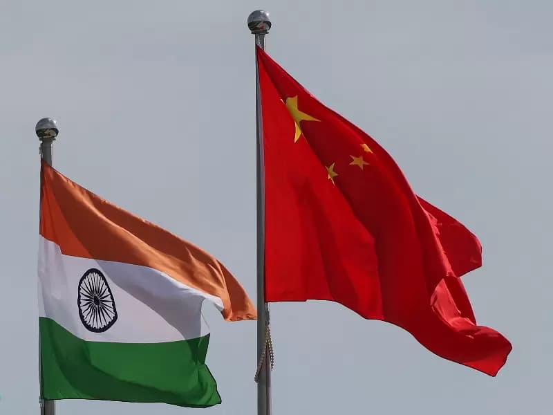 National flags of China and India fly next to the Meijiang Convention and Exhibition Center, a venue for 2025 Shanghai Cooperation Organisation (SCO) summit in Tianjin, China August 30, 2025.