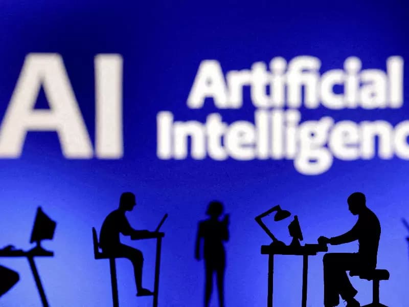 FILE PHOTO: Figurines with computers and smartphones are seen in front of the words "Artificial Intelligence AI" in this illustration taken, February 19, 2024.