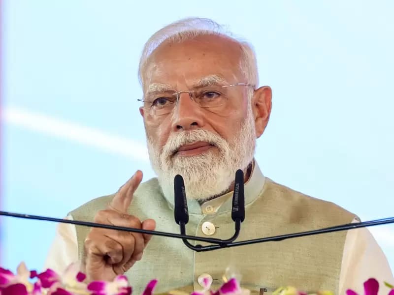 Prime Minister Narendra Modi speaks during the foundation stone laying and inauguration ceremony of various development projects during a public event in Kolkata, West Bengal, on Saturday, March 14, 2026.