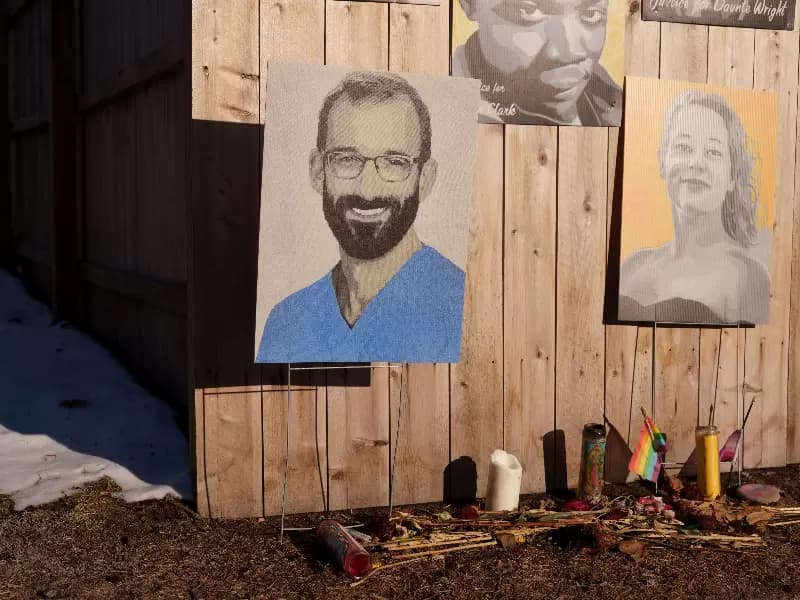 Images of Minnesota residents killed by law enforcement, including Renee Good and Alex Pretti, are kept on a fence near a memorial for Renee Good in Minneapolis, Minnesota, U.S., March 11, 2026.