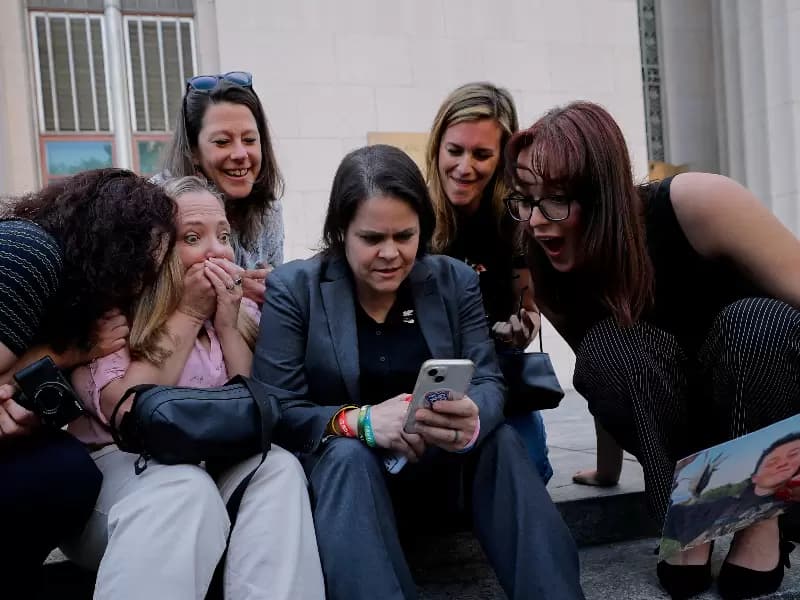 Amy Neville, mother of Alexander, Mary Rodee, mother of Riley Basford, Shelby Knox, lawyer Laura Marquez-Garrett, lawyer Lennon Torres and CEO of Heat Initiative Sarah Gardner react outside the court after the jury found Meta and Google liable in a key test case accusing Meta and Google's YouTube of harming children's mental health through addictive social media platforms, in Los Angeles, California, U.S., March 25, 2026.
