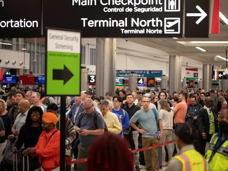 Passengers wait in line to access a Transportation Security Administration (TSA) security checkpoint inside the domestic terminal at Hartsfield-Jackson Atlanta International Airport in Atlanta, Georgia, U.S. March 27, 2026.