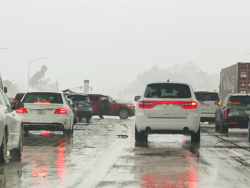 FILE PHOTO: A car spins-out on the freeway during a "winter rain storm" near Mission Viejo, California, U.S., October 14, 2025. REUTERS/Mike Blake/File Photo