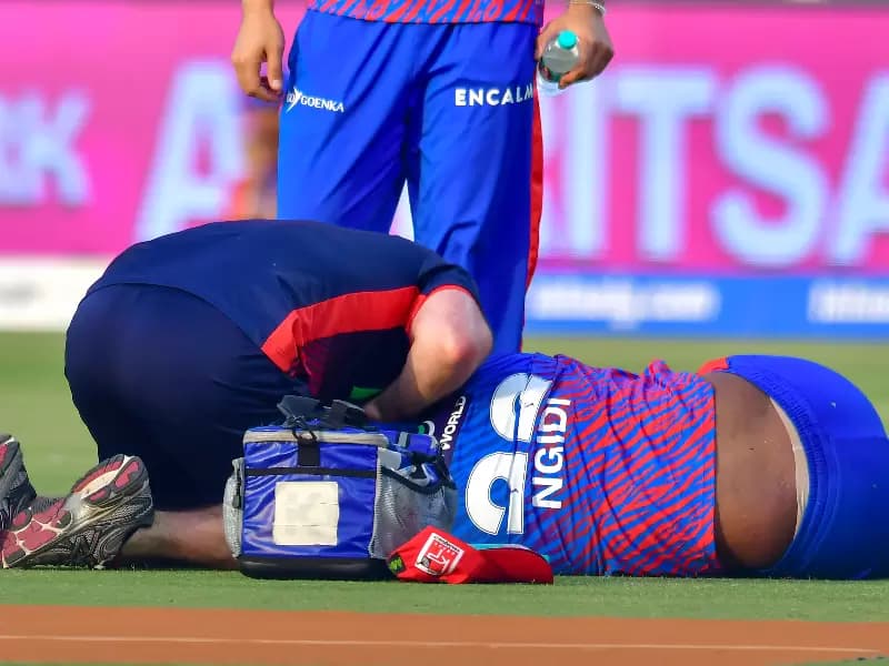 Delhi Capitals' Lungi Ngidi being treated by the team physio after he suffered an injury during the Indian Premier League (IPL) 2026 match between Delhi Capitals and Punjab Kings at Arun Jaitley Stadium in New Delhi on Saturday, April 25, 2026.
