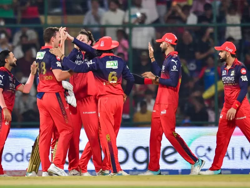 Royal Challengers Bengaluru's Josh Hazlewood celebrates with teammates after the dismissal of Delhi Capitals' Nitish Rana during the Indian Premier League (IPL) 2026 match between Delhi Capitals and Royal Challengers Bengaluru at Arun Jaitley Stadium in New Delhi on Monday, April 27, 2026.