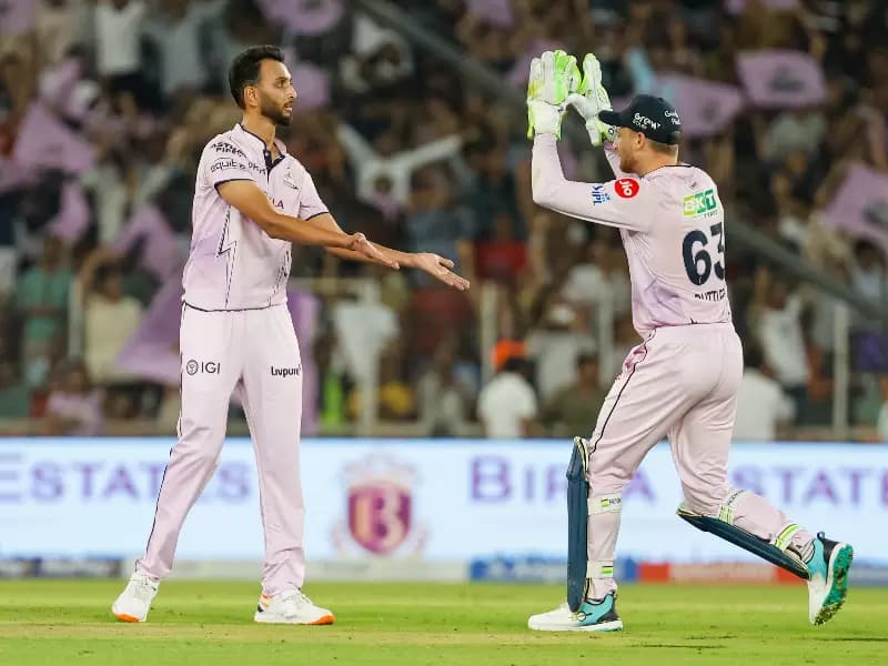 Gujarat Titans' Prasidh Krishna celebrates with teammates after dismissing Sunrisers Hyderabad captain Pat Cummins during the Indian Premier League 2026 match between Gujarat Titans and Sunrisers Hyderabad, at the Narendra Modi Stadium in Ahmedabad on Tuesday, May 12, 2026.