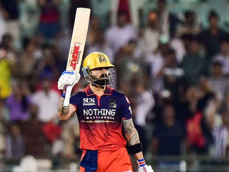Royal Challengers Bengaluru's Virat Kohli celebrates after scoring a century during the Indian Premier League (IPL) 2026 match between Royal Challengers Bengaluru and Kolkata Knight Riders at the Shaheed Veer Narayan Singh International Cricket Stadium in Nava Raipur on Wednesday, May 13, 2026.