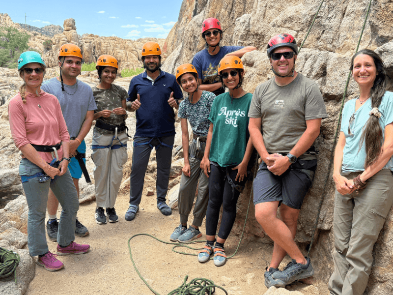 Participants rock climbing as part of the program.