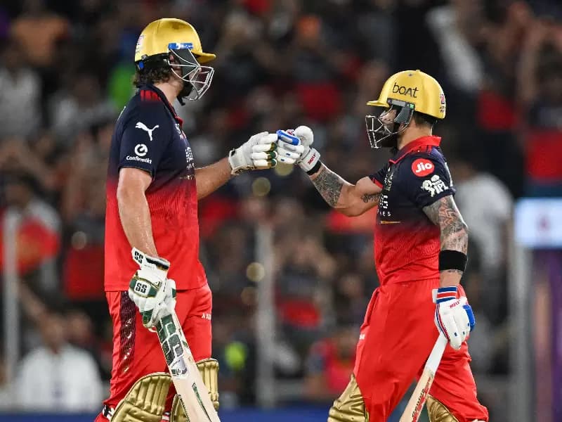 Royal Challengers Bengaluru's Virat Kohli and Tim David during the Indian Premier League (IPL) 2026 final match between Royal Challengers Bengaluru and Gujarat Titans in Ahmedabad, Gujarat, on Sunday, May 31, 2026.