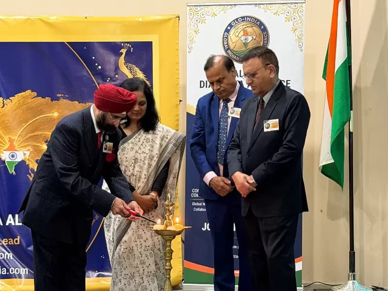 H.S. Panaser, president of GLO-INDIA lighting the lamp