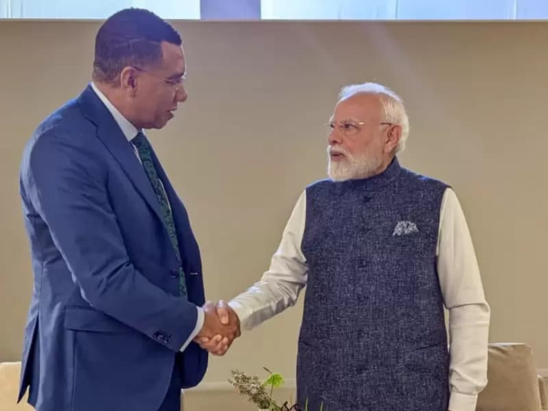 Prime Minister Narendra Modi interacts with Jamaica’s Prime Minister Andrew Holness during the G20 Summit in Johannesburg, Sunday, November 23, 2025.